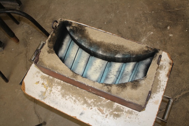 Sand Mold section for COLLIDER right before being poured. The powder is ground glass and used as pigment.