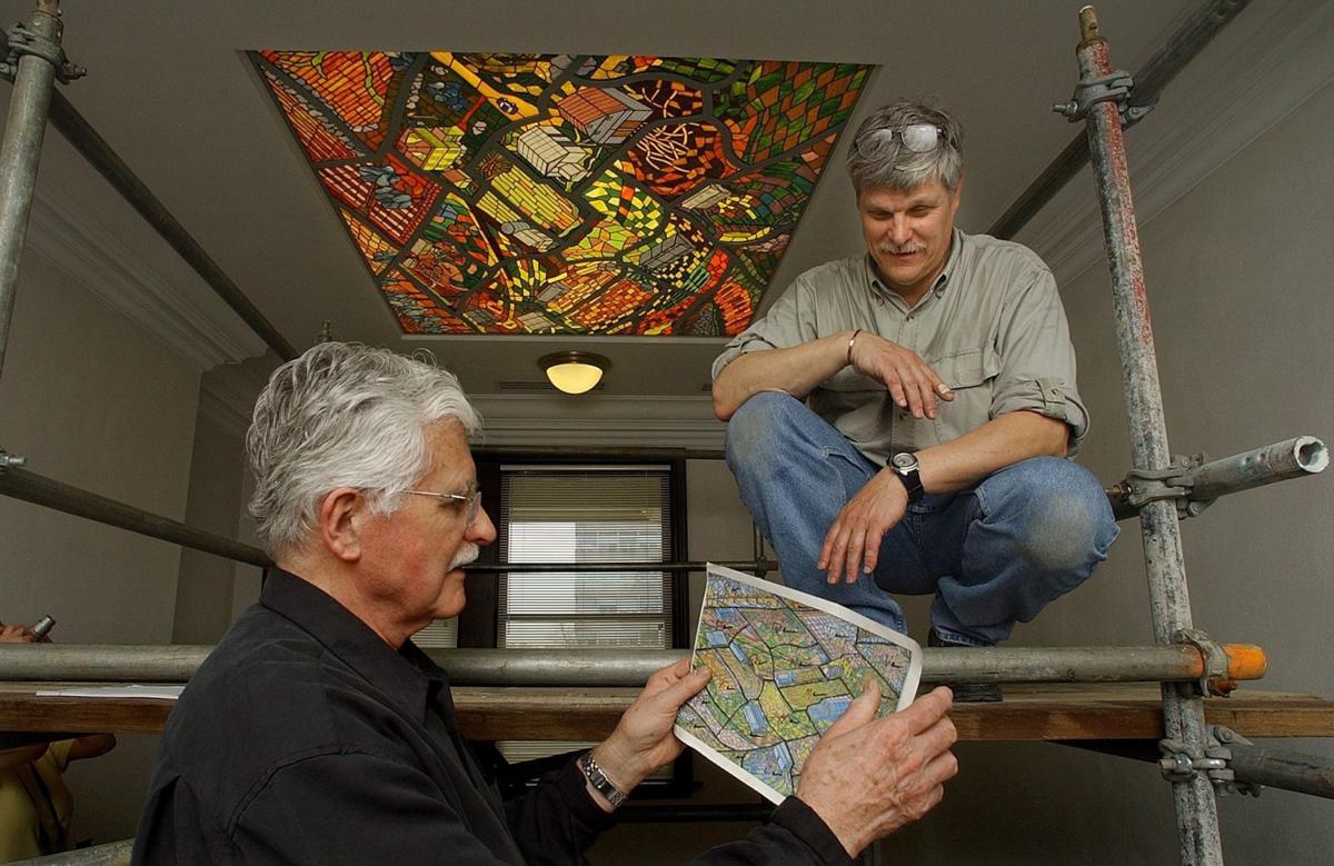 Artist Harold Gregor, left, holds the miniature guide of his painting which was translated into glass by artist Terry Garbe of Normal in 2006. Gregor said he painted a full scale version twice for the project which Garbe transcribed into 3500 pieces