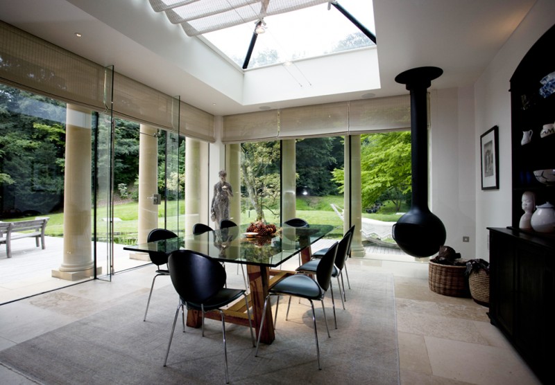 Genuine French Pinoleum in a contemporary garden room with hanging fireplace