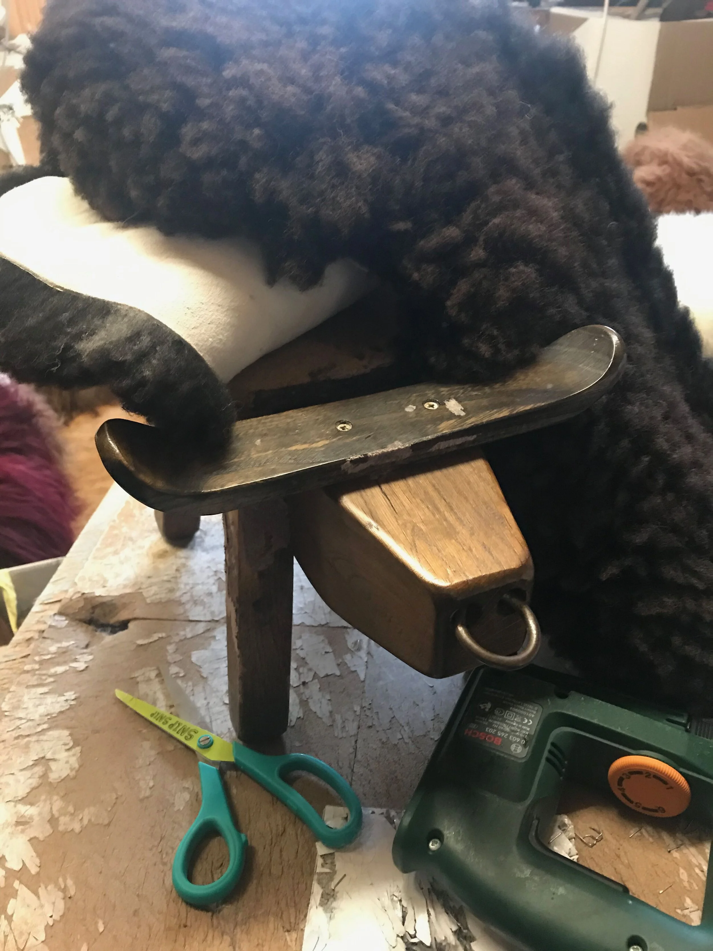 Naked boy with ian’s chosen sheepskin.