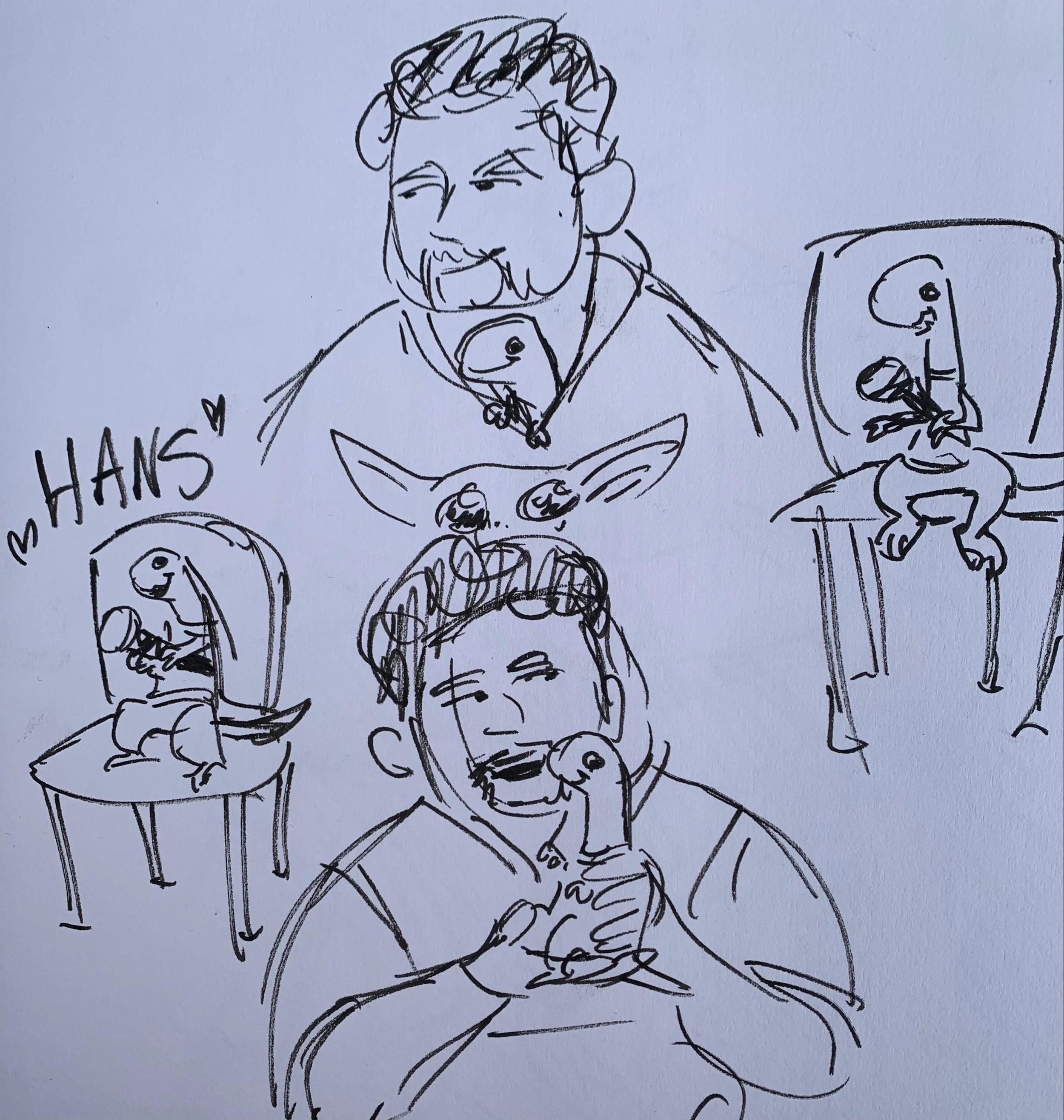 A black ink sketch of a man with a beard and mustache, sitting at a table with a plate of food and chopsticks, smiling while eating. There is a cartoonish face drawing on a can or container beside him, and a partially visible figure sitting on the right.