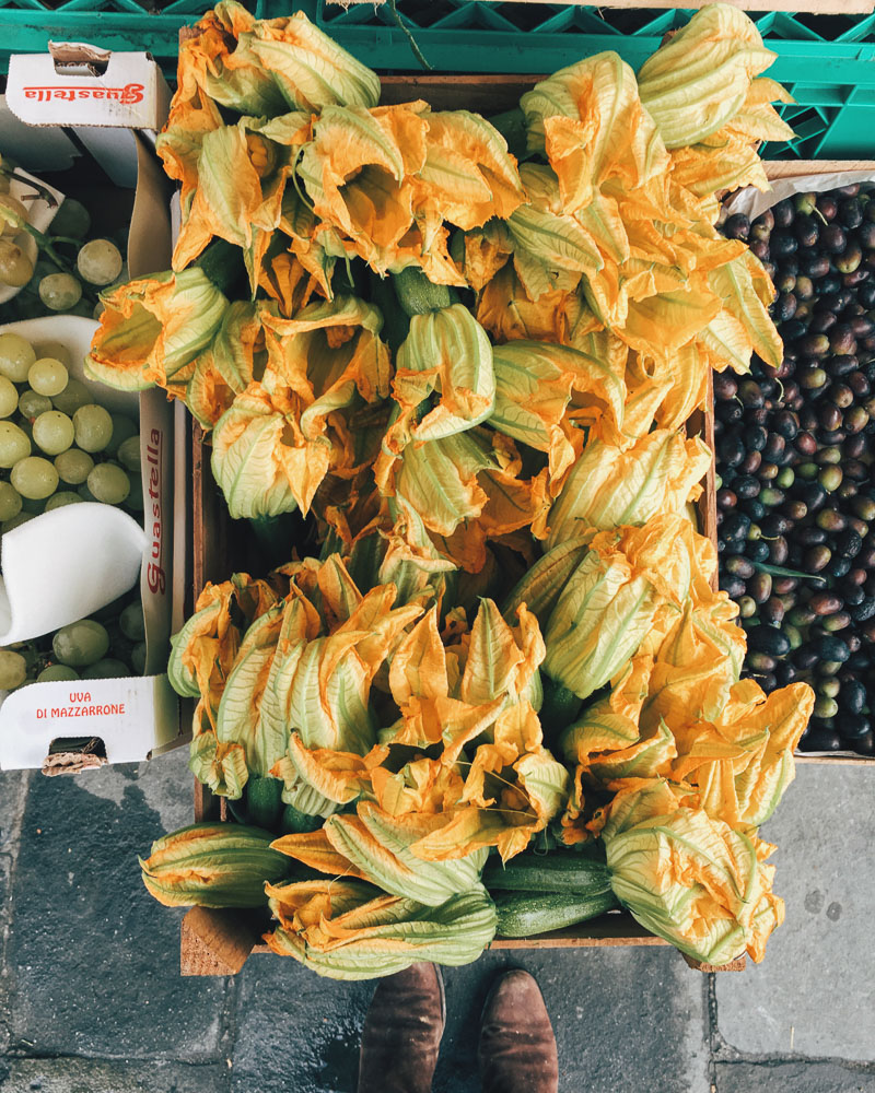 Courgette flowers for sale at the market, ideal for stuffing