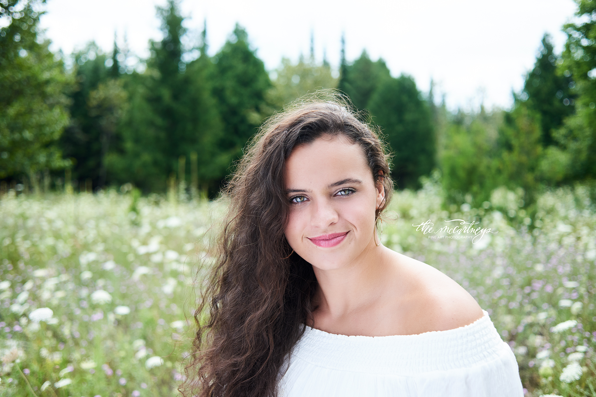 "My session exceeded my expectations. The McCartneys Photography is definitely the way to go when it comes to getting your senior portraits taken. I am so grateful I was able to be a senior rep for this outstanding photography studio. I've been looking forward to my senior pictures ever since elementary school. I remember looking at all the beautiful pictures my friends' older siblings had taken and hearing about their experiences with the local photography studios. When it was my turn to enter high school, senior pictures were the last thing on my mind because I was so focused on my school work. Fortunately, some of my upperclassmen friends began having their senior pictures taken, and my mind started daydreaming about my senior portrait experience. Many of those upperclassmen friends of mine went through The McCartneys Photography to get their pictures taken; I heard nothing but positive feedback from their experiences. I decided to follow Kelsy and Butch on social media and gawk over their images they create. My experience started with a stomach full of nerves and ended with a heart overflowing with joy. This power couple made me feel so welcomed, confident, and beautiful. Kelsy and Butch work extremely well together and are very invested in making the overall experience of their models feel ever so special. During the photo shoot and going through all of the images that were created, Kelsy and Butch continued to be their bubbly, funny, compassionate, committed photographers that they are. I recommend The McCartneys Photography to those looking for photographers near you...they are simply the best. Thank you Kelsy and Butch for this memorable experience; it definitely fulfilled my senior portrait daydreams. I cannot wait for the next session!" -Erin Gruber, Wausau West, Class of 2018