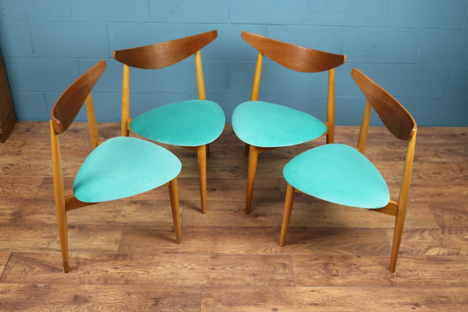 G-Plan three-legged dining chairs by Richard Young