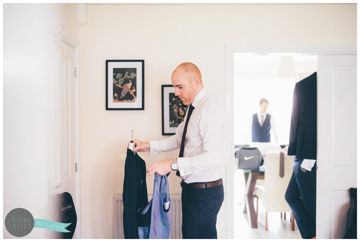 Groom gets ready on the morning of his wedding in his Best Man's house.