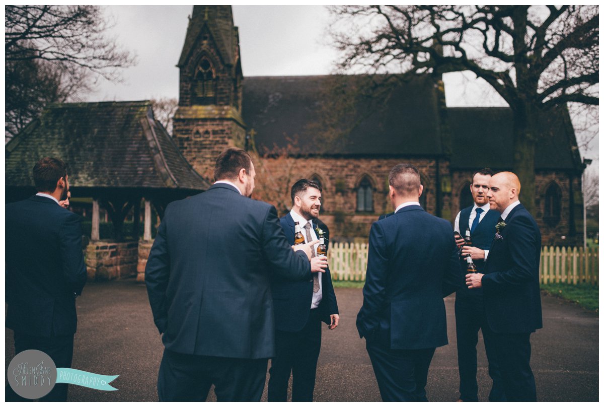 The groomsmen all stand and before the wedding ceremony in Knutsford, Cheshire.