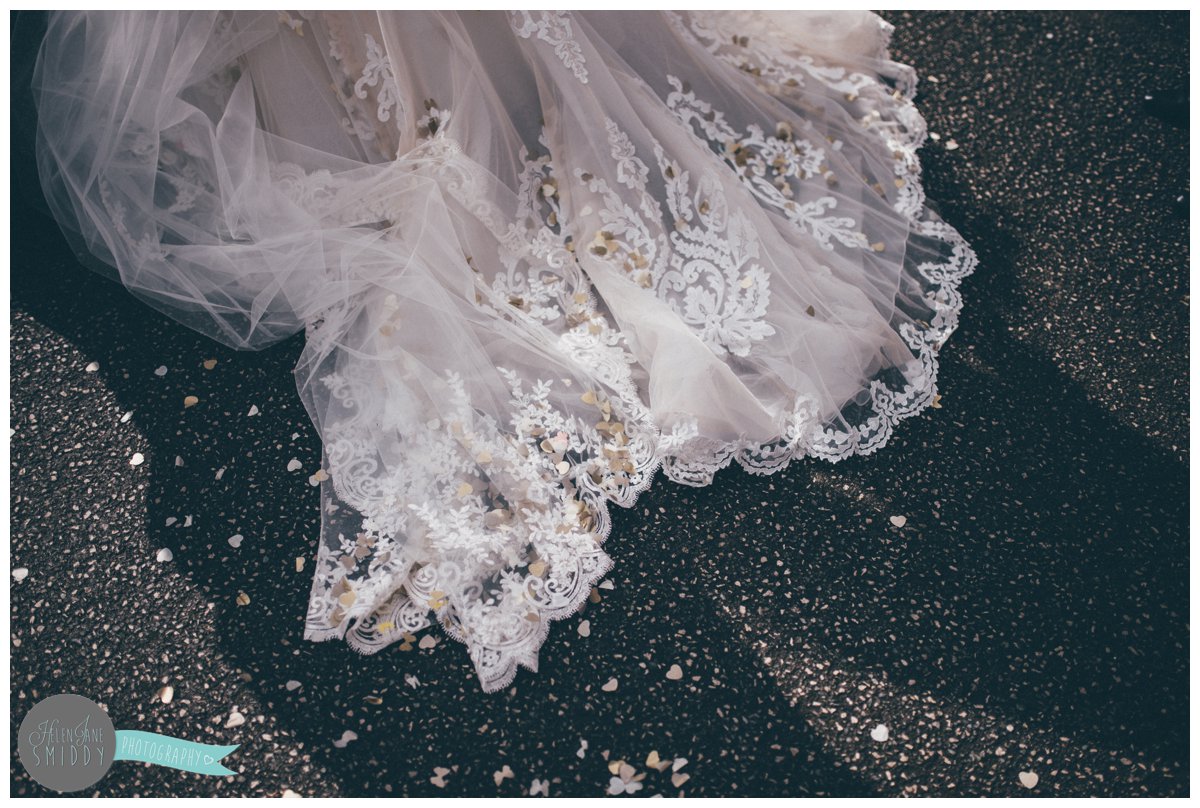 The train of Lyssa's Maggie Sottero gown was covered in confetti after the guests had thrown it at her.