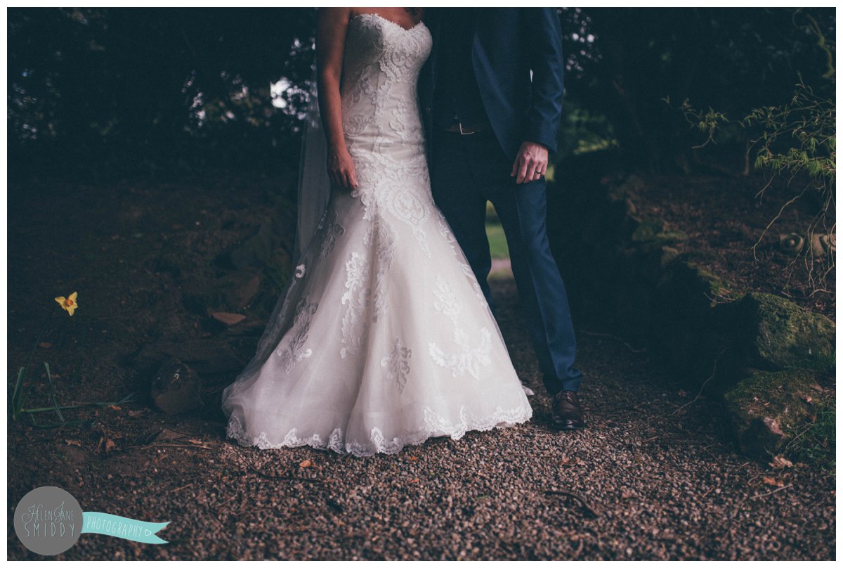 The details of Lyssa and Dom's wedding outfits compliment each other on their wedding day at Mere Court Hotel in Knutsford.