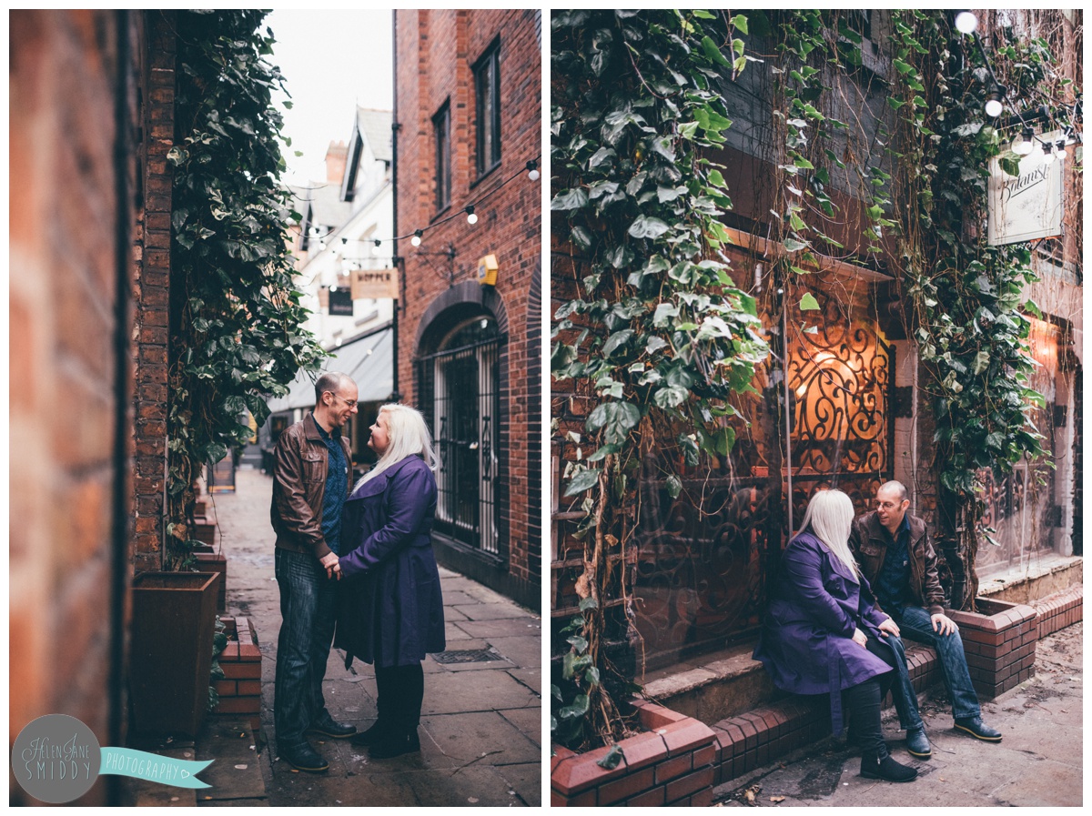 The pre-wedding shoot of Alan and Joanna in Chester City Centre against the greenery in the alleyway next to the Botanist.