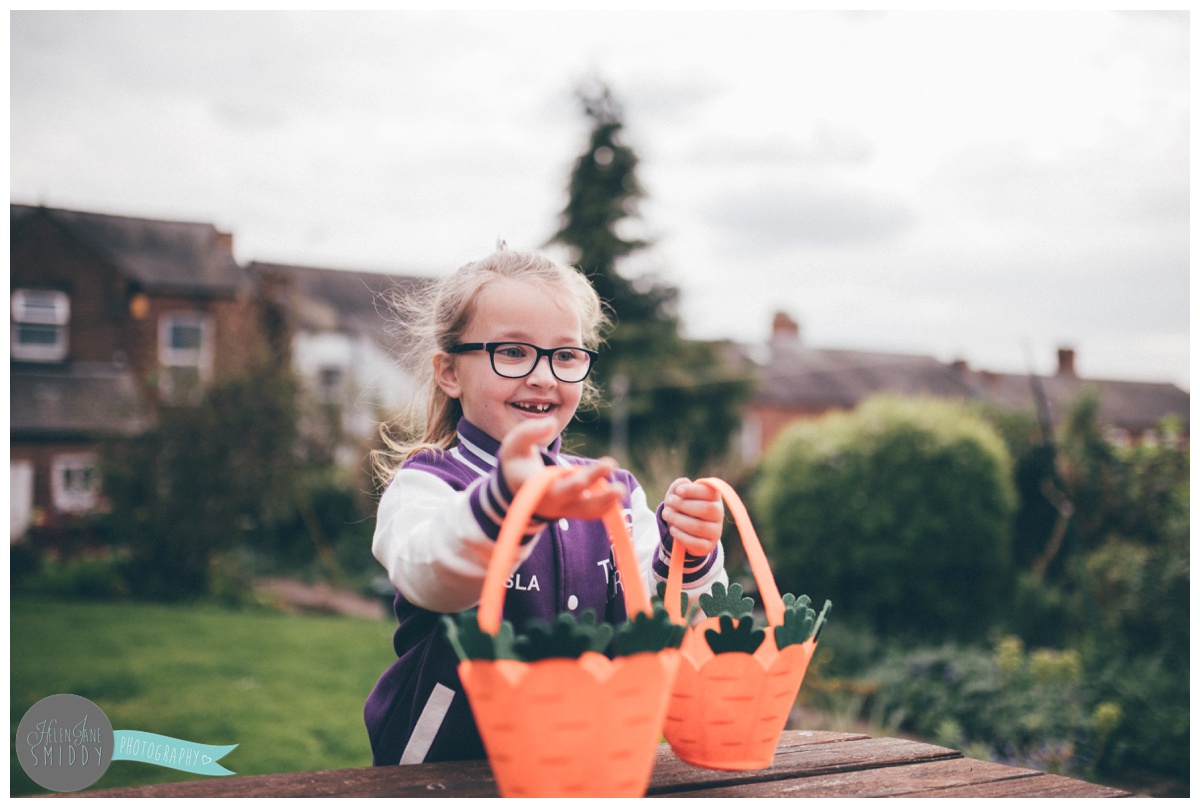 Isla picks up the baskets for the Frodsham Easter Egg hunt.