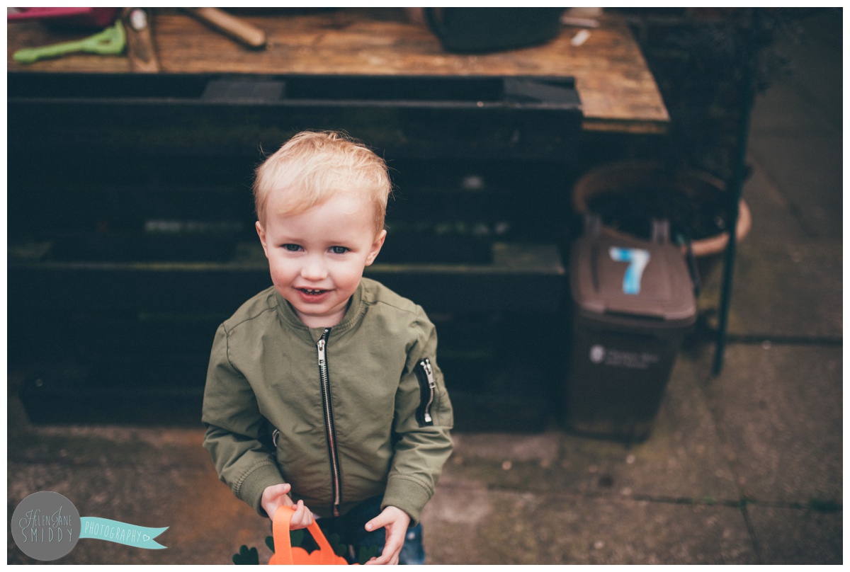 Cute little boy grins up at the Frodsham photographer.