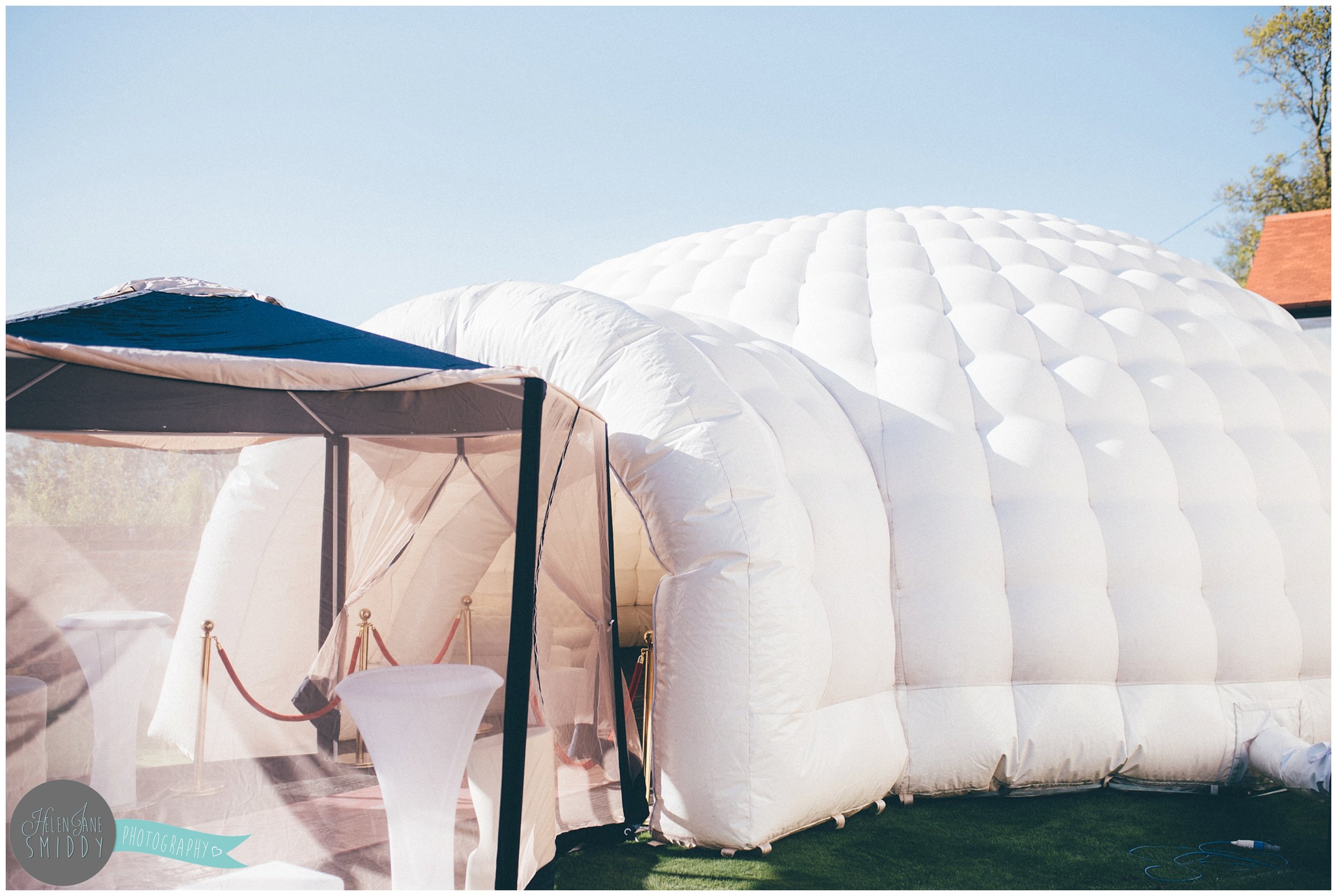A large inflatable igloo in a garden party in Helsby.