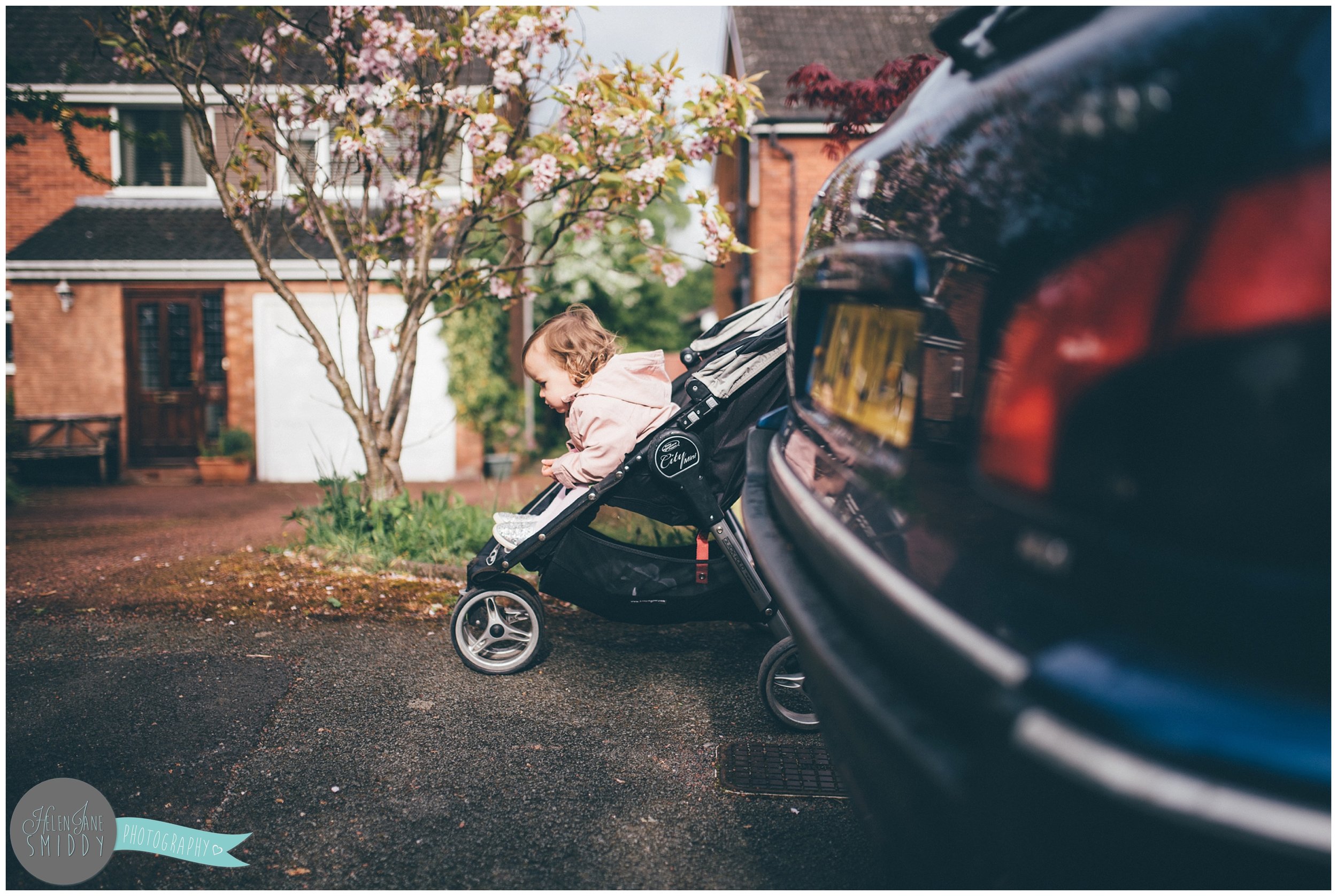 Little Zoe in her buggy during A Day In The Life photoshoot in Frodsham, Cheshire.
