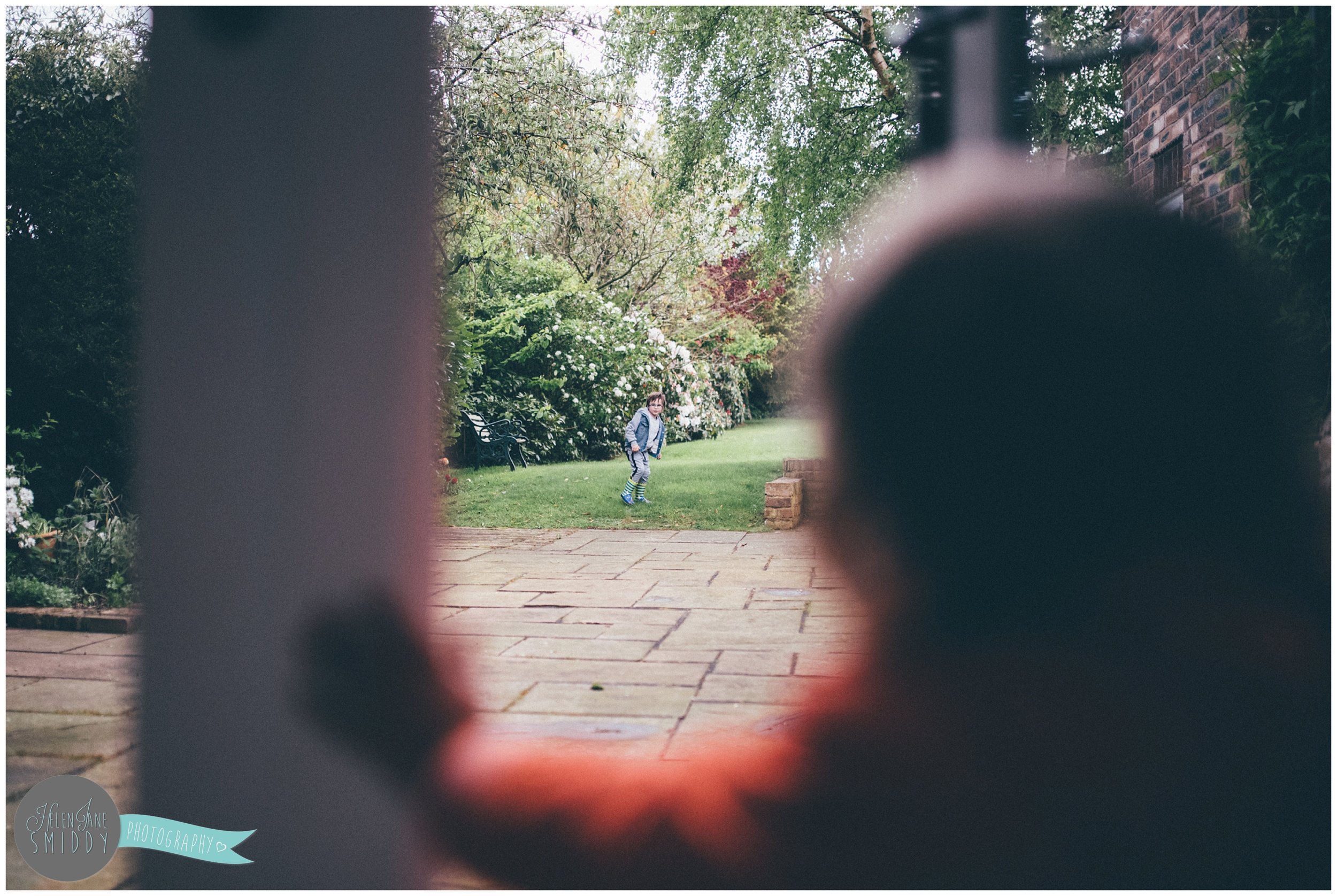 Family time in their Frodsham garden during an A Day In The Life photoshoot in Cheshire.