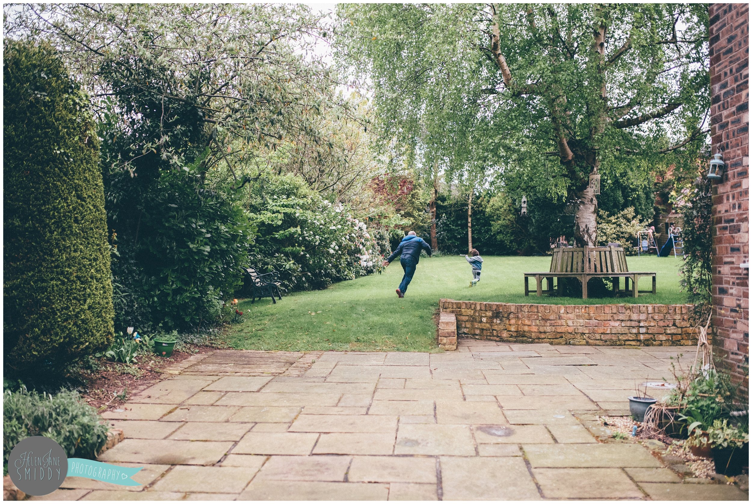 Family time in their Frodsham garden during an A Day In The Life photoshoot in Cheshire.