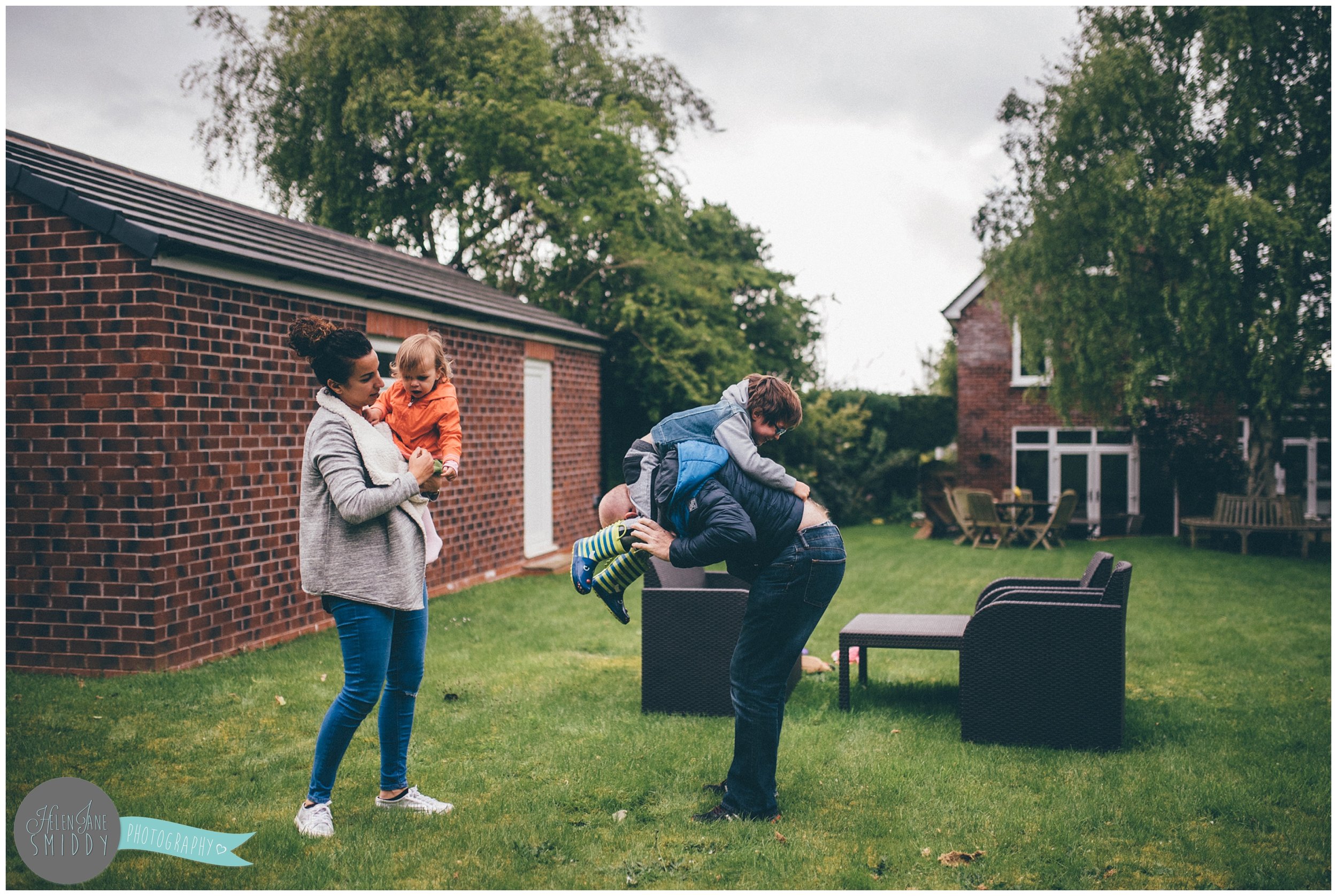 Family time in their Frodsham garden during an A Day In The Life photoshoot in Cheshire.