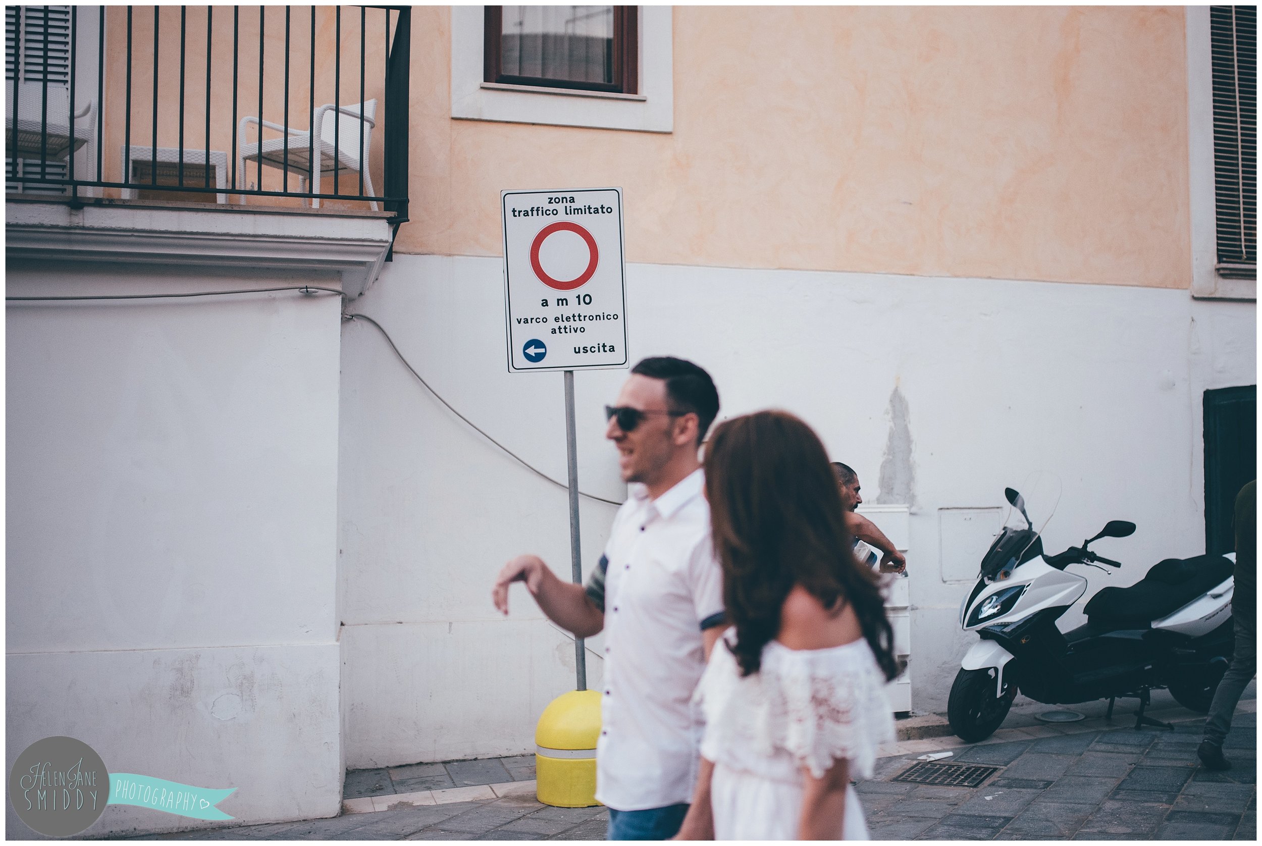 The couple chat during their engagement shoot in Italy.