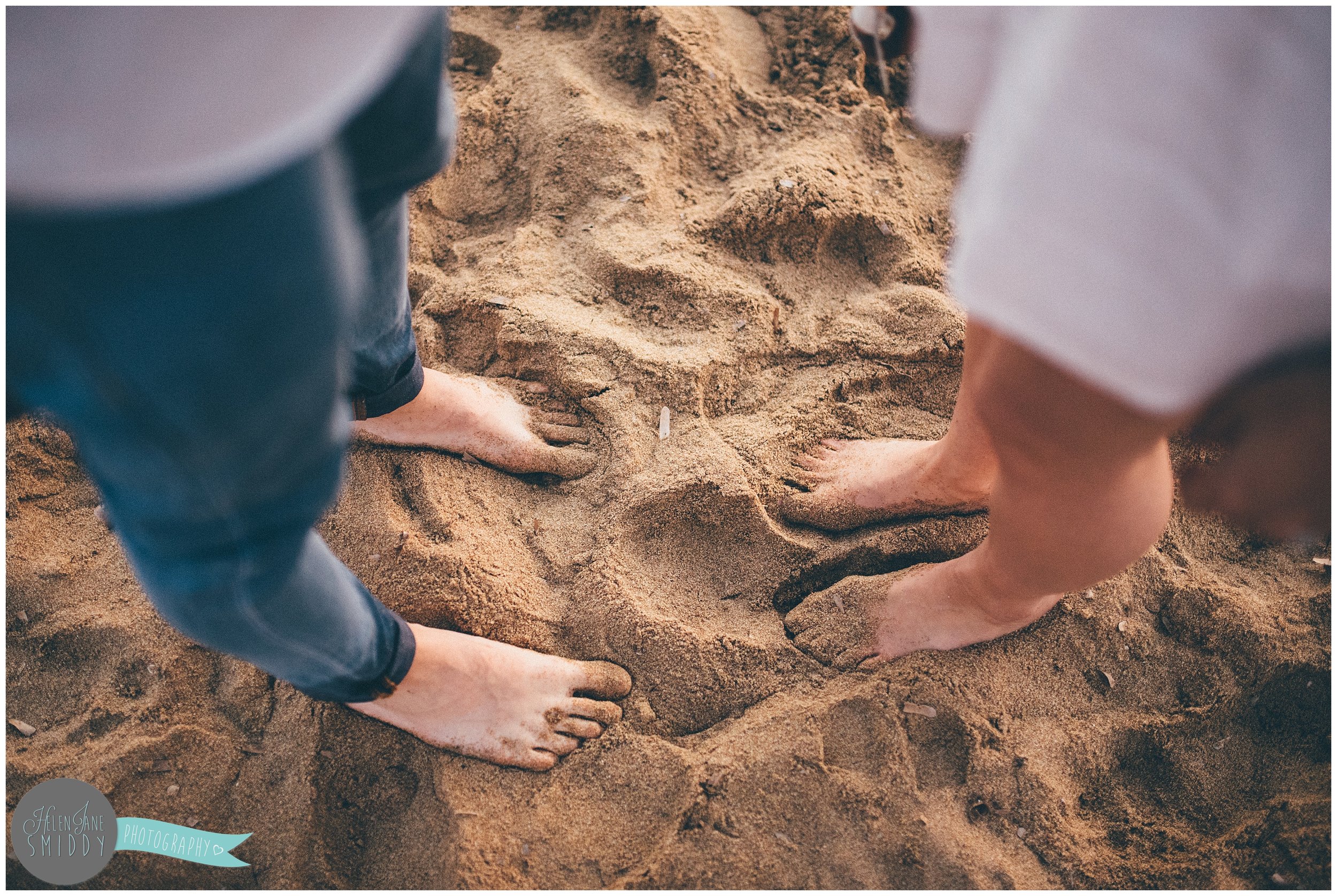 Sandy feet on the beach in Santa Maria di Castellabate, Italy.