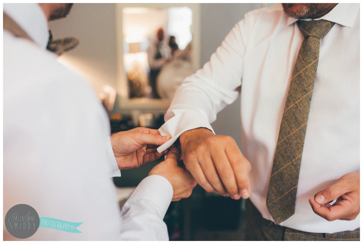 The groom and his groomsmen get ready at Mottram Hall in Cheshire.
