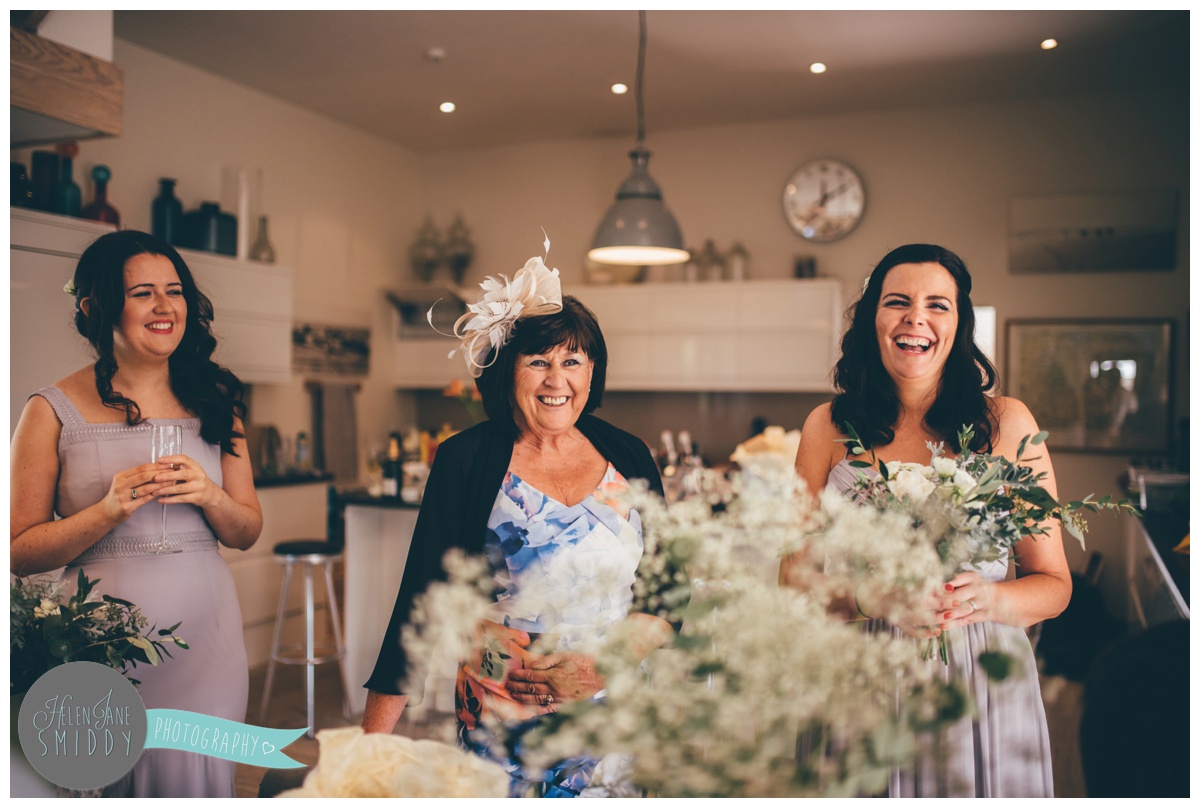 Bridesmaids share a joke on the morning of the Norfolk wedding.