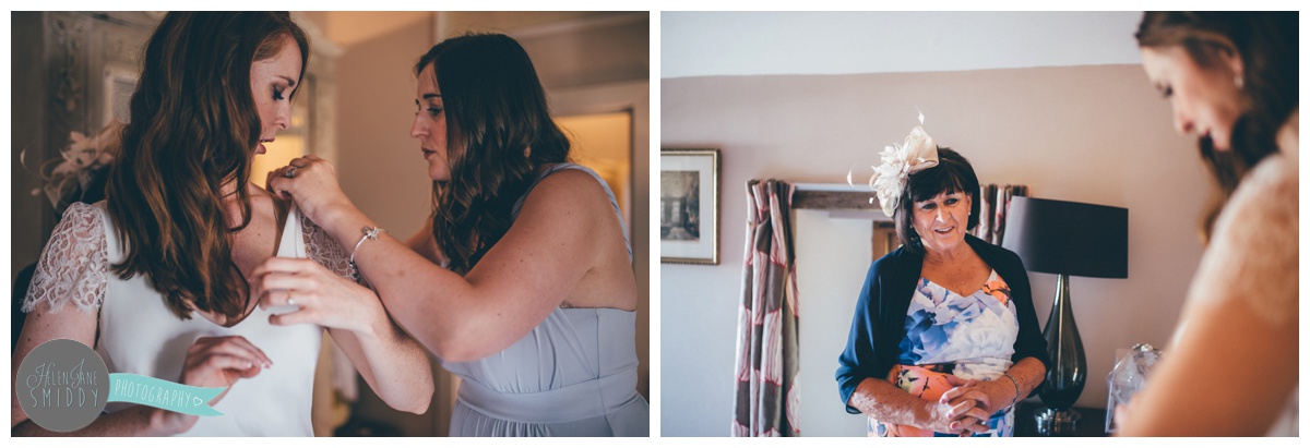 Bridesmaid puts finishing touches on her friend.