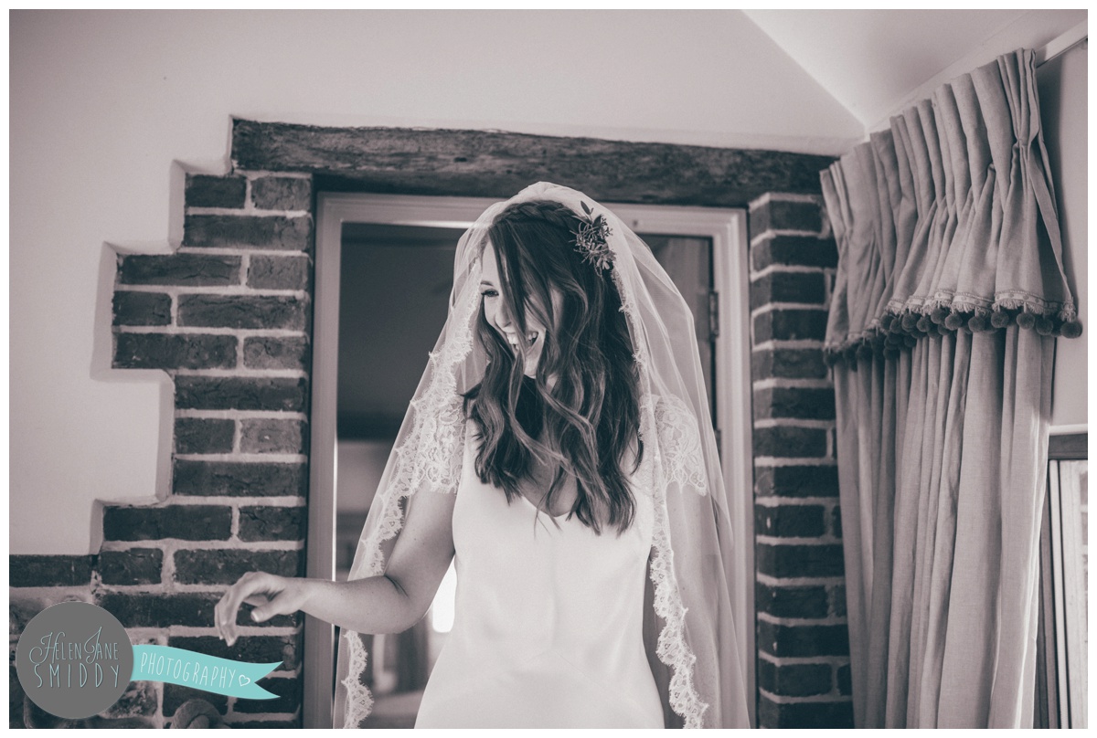 Bride appears in front of all of her friends and family.