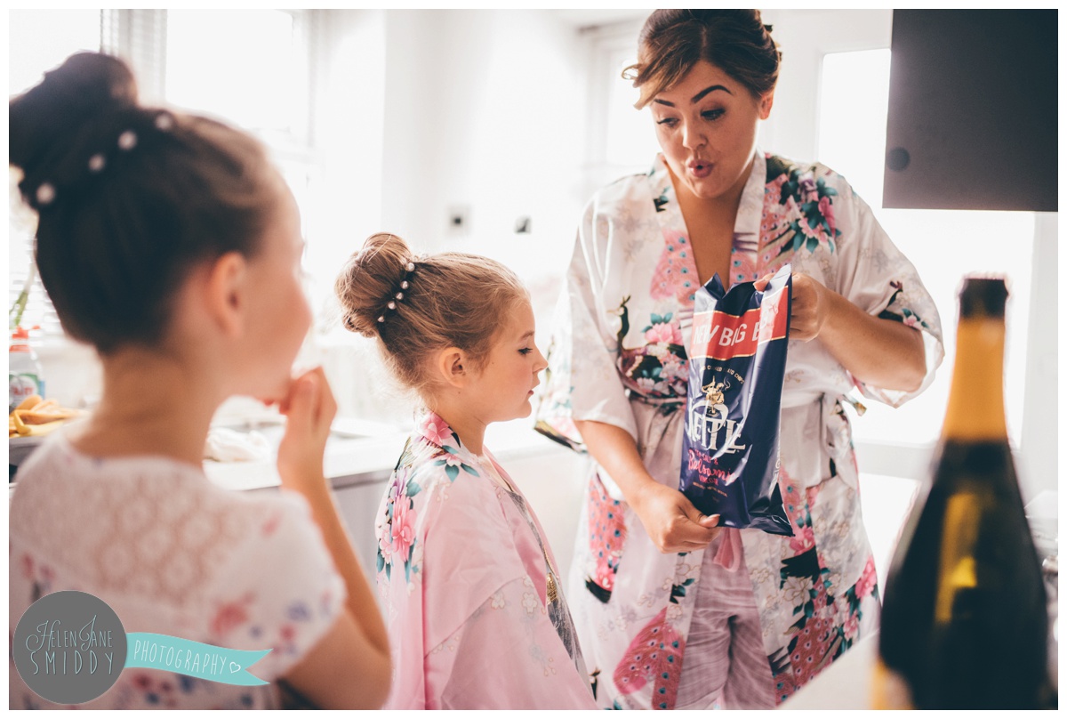 The bridal party gather in their matching dressing gowns.