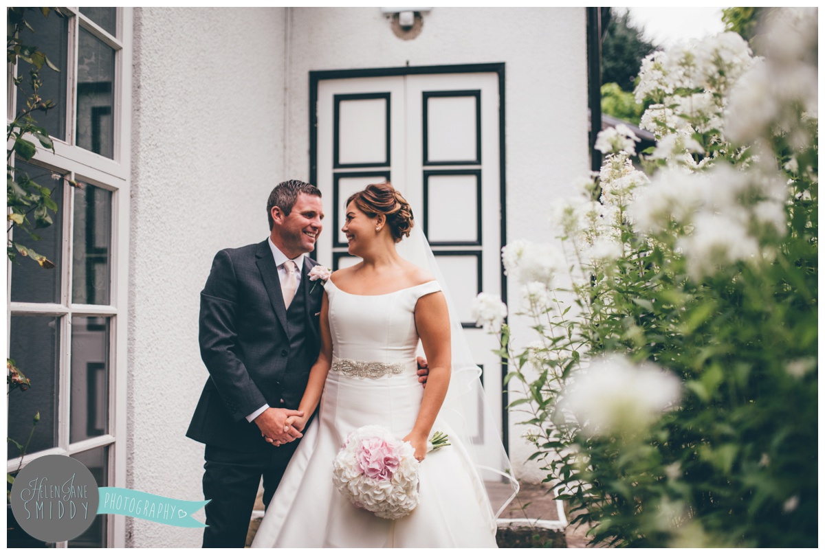 The newlyweds pose for their couple portraits on their wedding day.