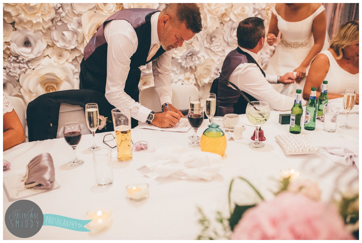Father of the bride makes last minute changes to his wedding speech.
