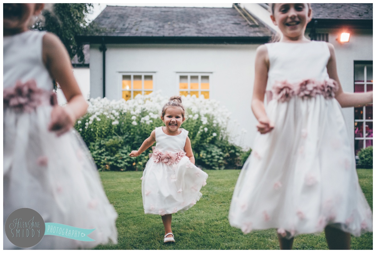 The flower girls have fun at the wedding at Statham Lodge.