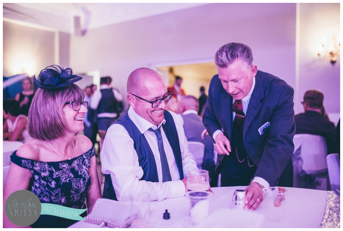 The magician performs for wedding guests at Statham Lodge in Cheshire.