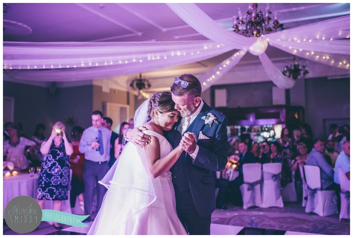 The bride and her Dad have an emotional first dance at Statham Lodge in Cheshire.