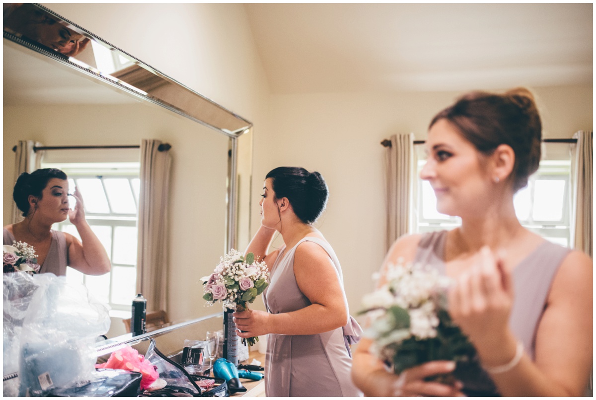 Bridesmaid checks out her wedding make-up.