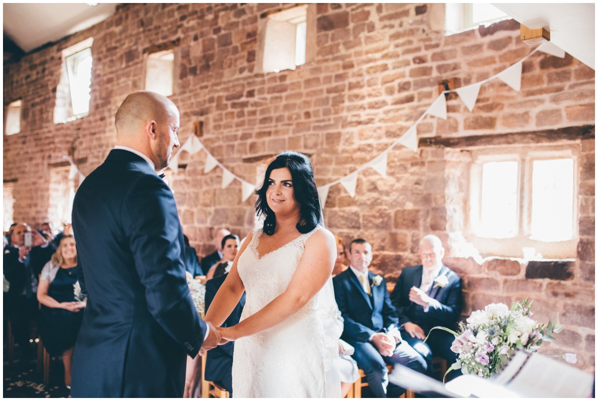 Amy and Phil take their vows at The Ashes wedding barn in Staffordshire.