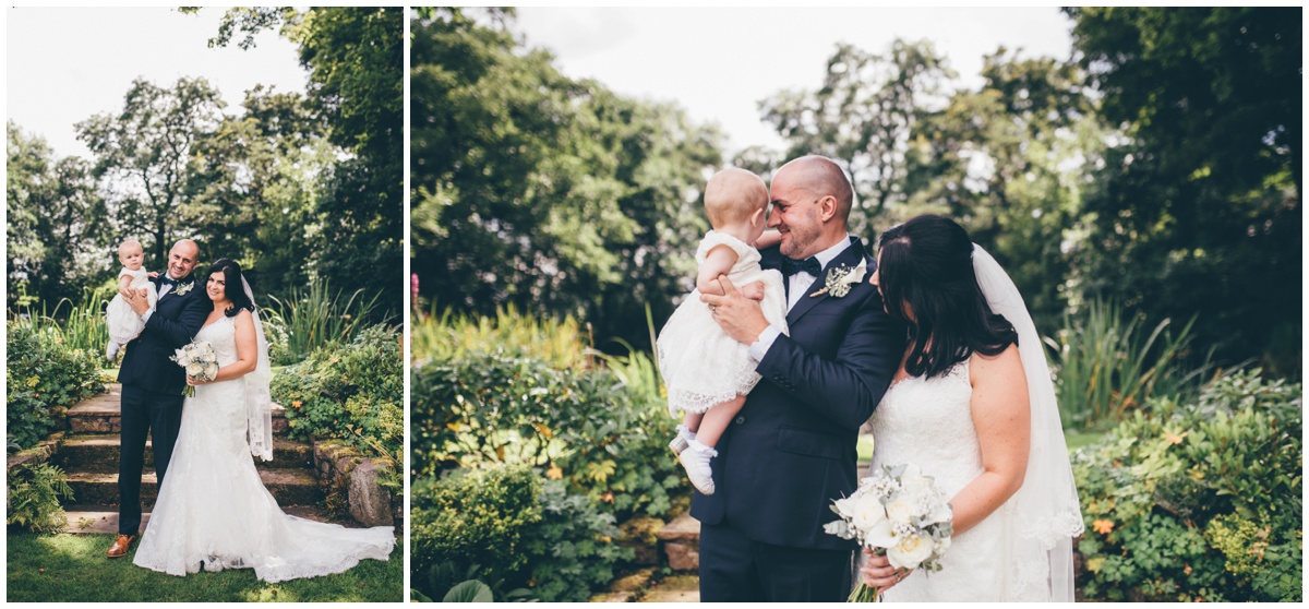 The bride and groom and their little girl at The Ashes wedding barn in Staffordshire.