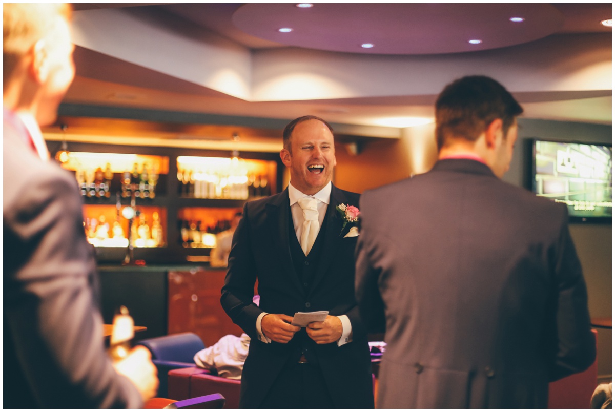 The groom shares a joke with his family and friends before his wedding ceremony in Manchester.