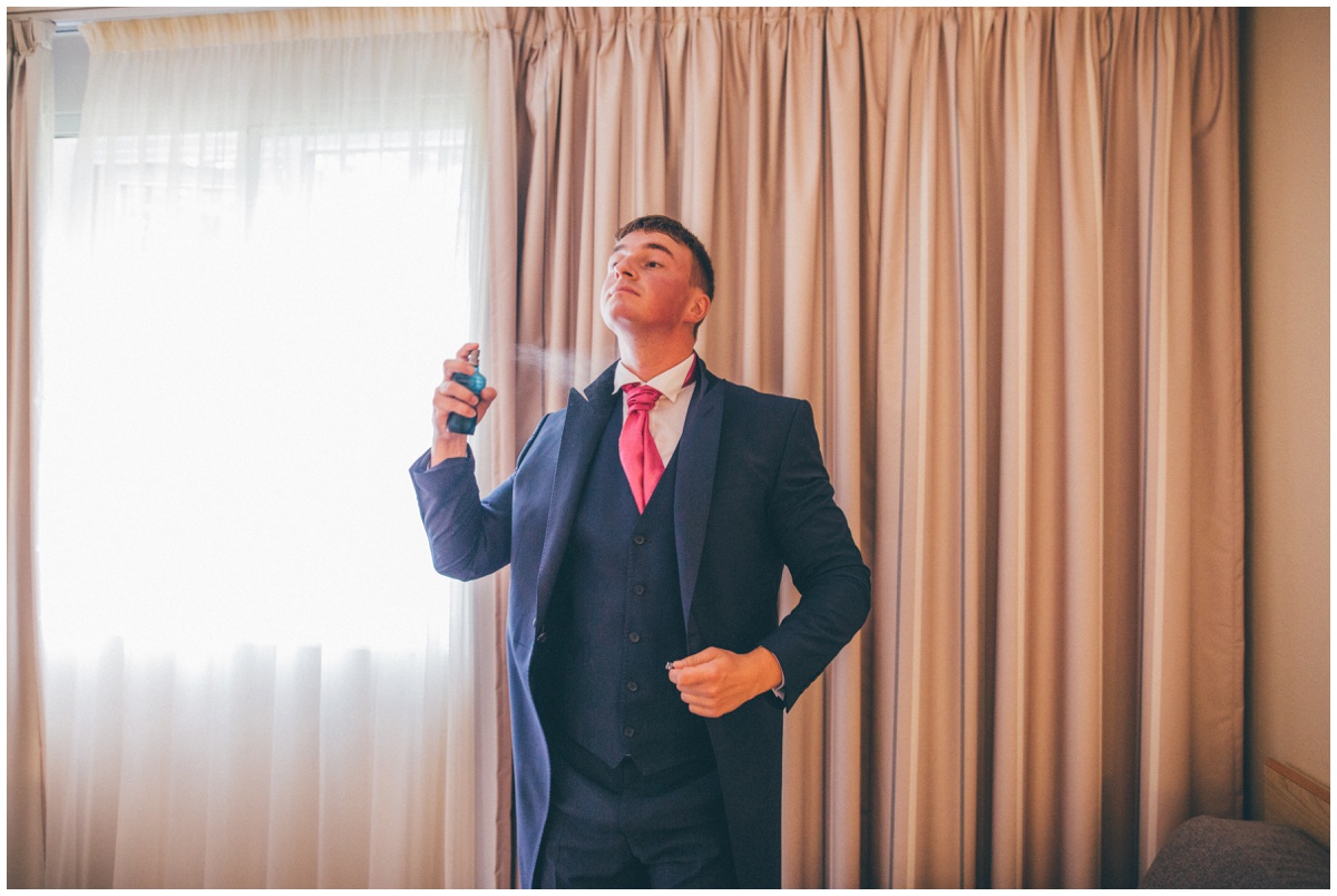 The Best Man sprays his aftershave on the morning of the Manchester wedding.