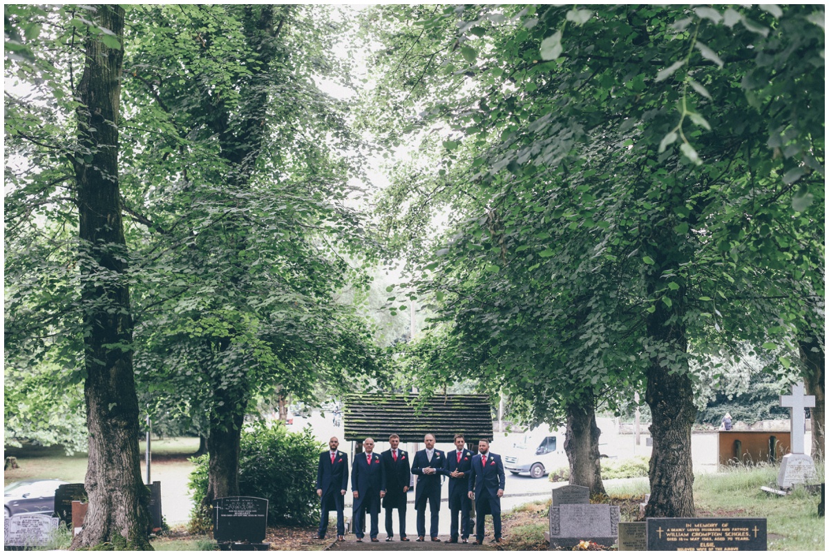 Groomsmen walking into St Marks Church in Worsley.