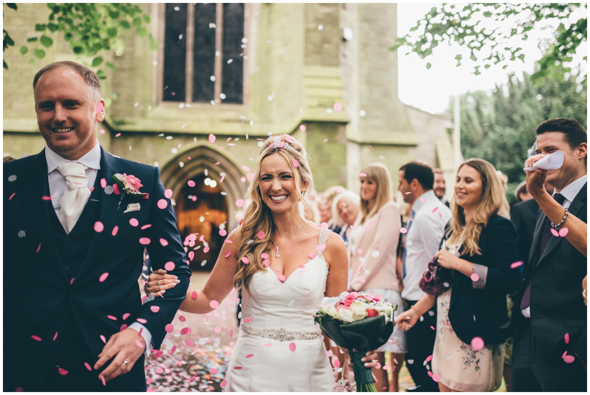 Beautiful and colourful confetti thrown over the bride and groom outside St Mark's Church in Worsley.