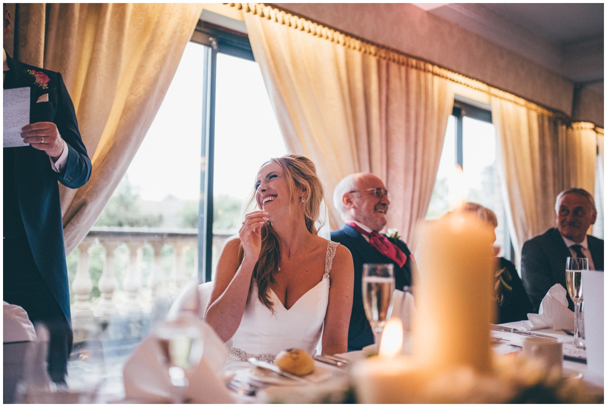 Bride laughs at her new husband's speech