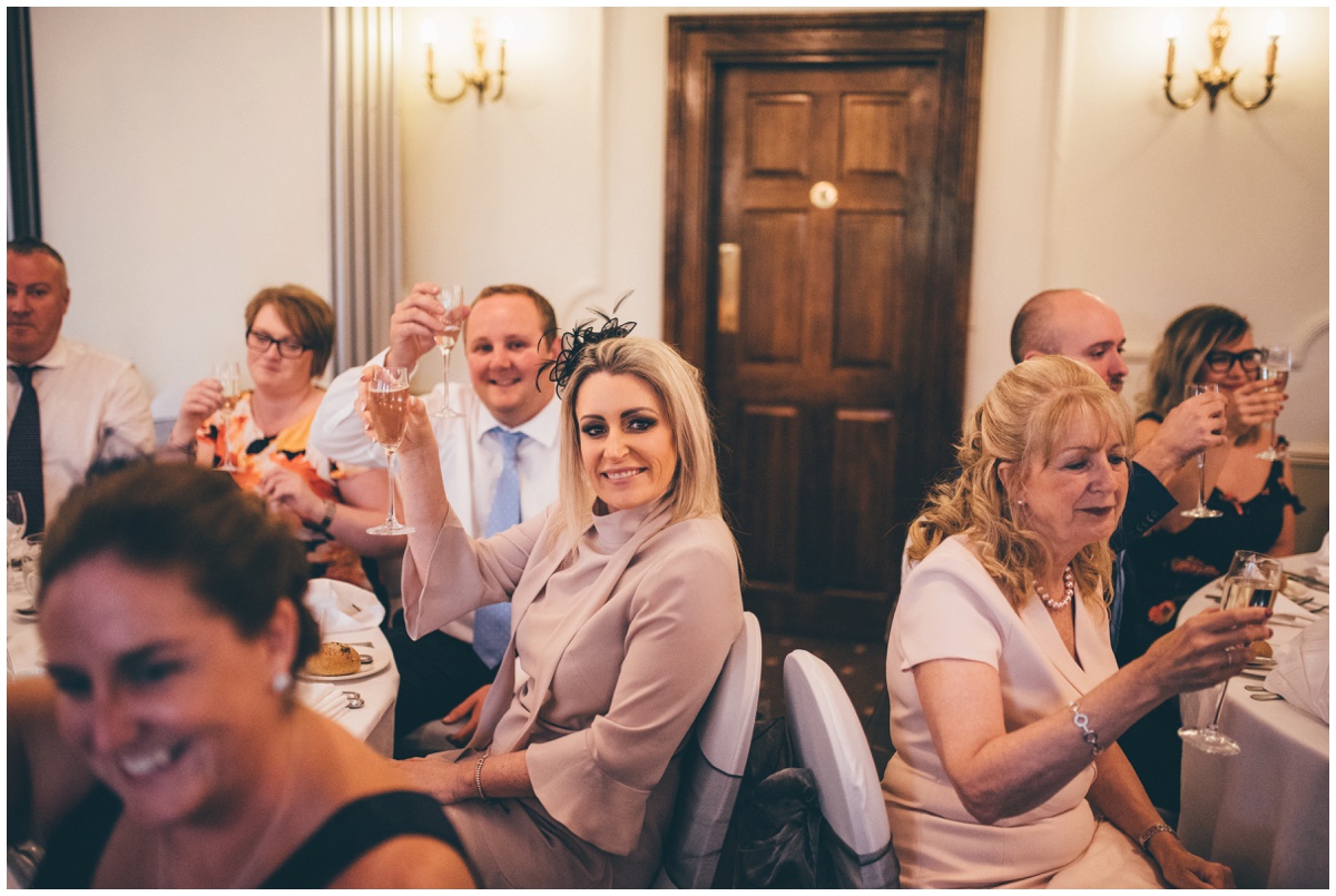 Guests say 'cheers' during the speeches at Willington Hall in Tarporley, Cheshire.