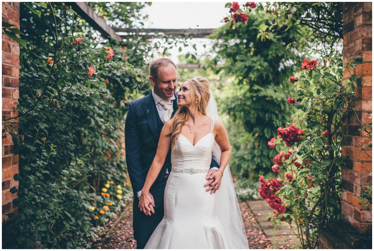 Couple portraits in the flower gardens at Willington Hall.