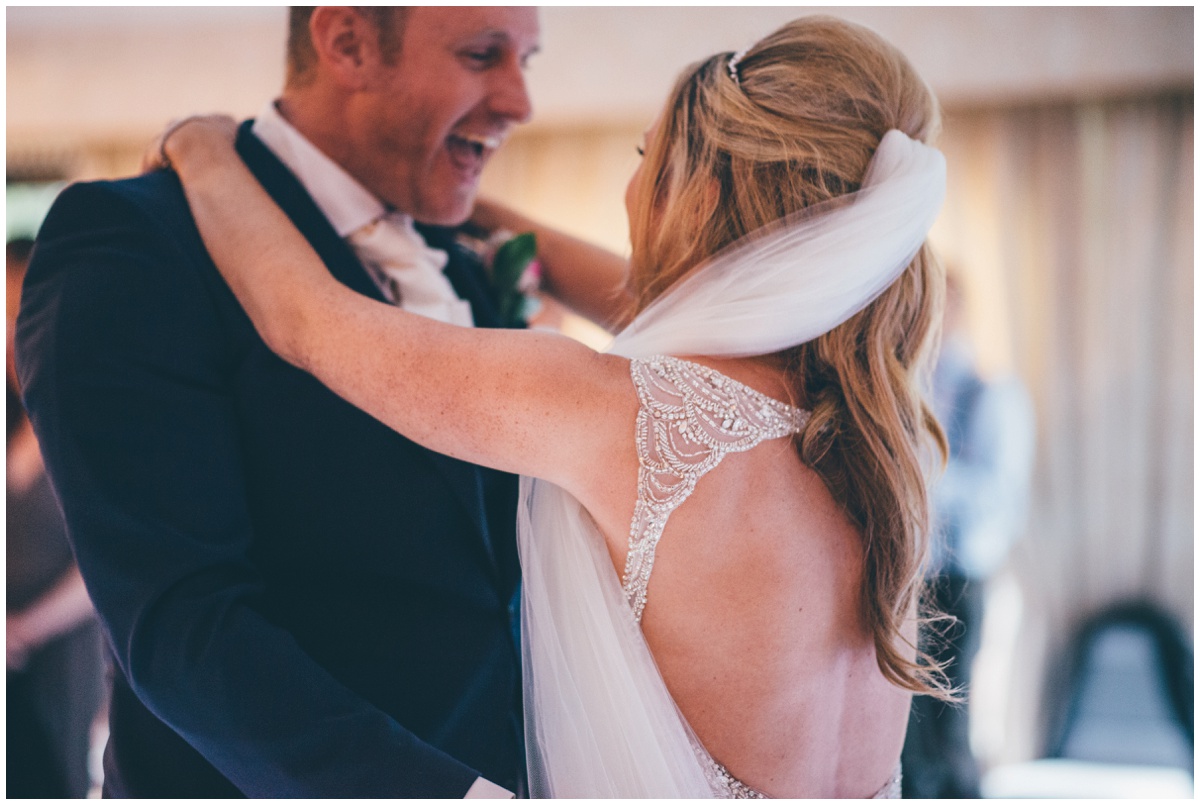 Detailed photograph of the bride's beautiful wedding gown.