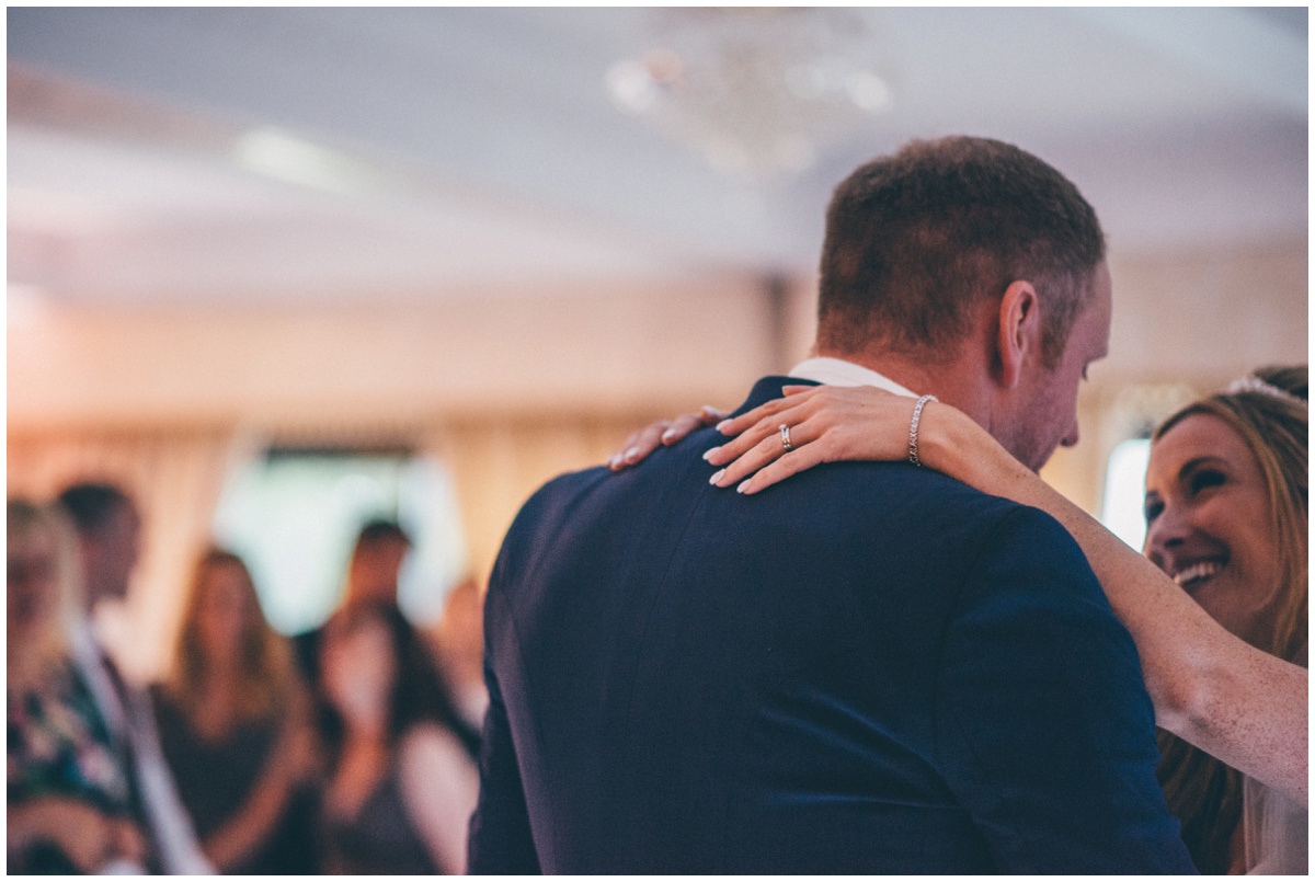 Detailed photograph of the bride and groom during their First Dance at their Cheshire wedding.