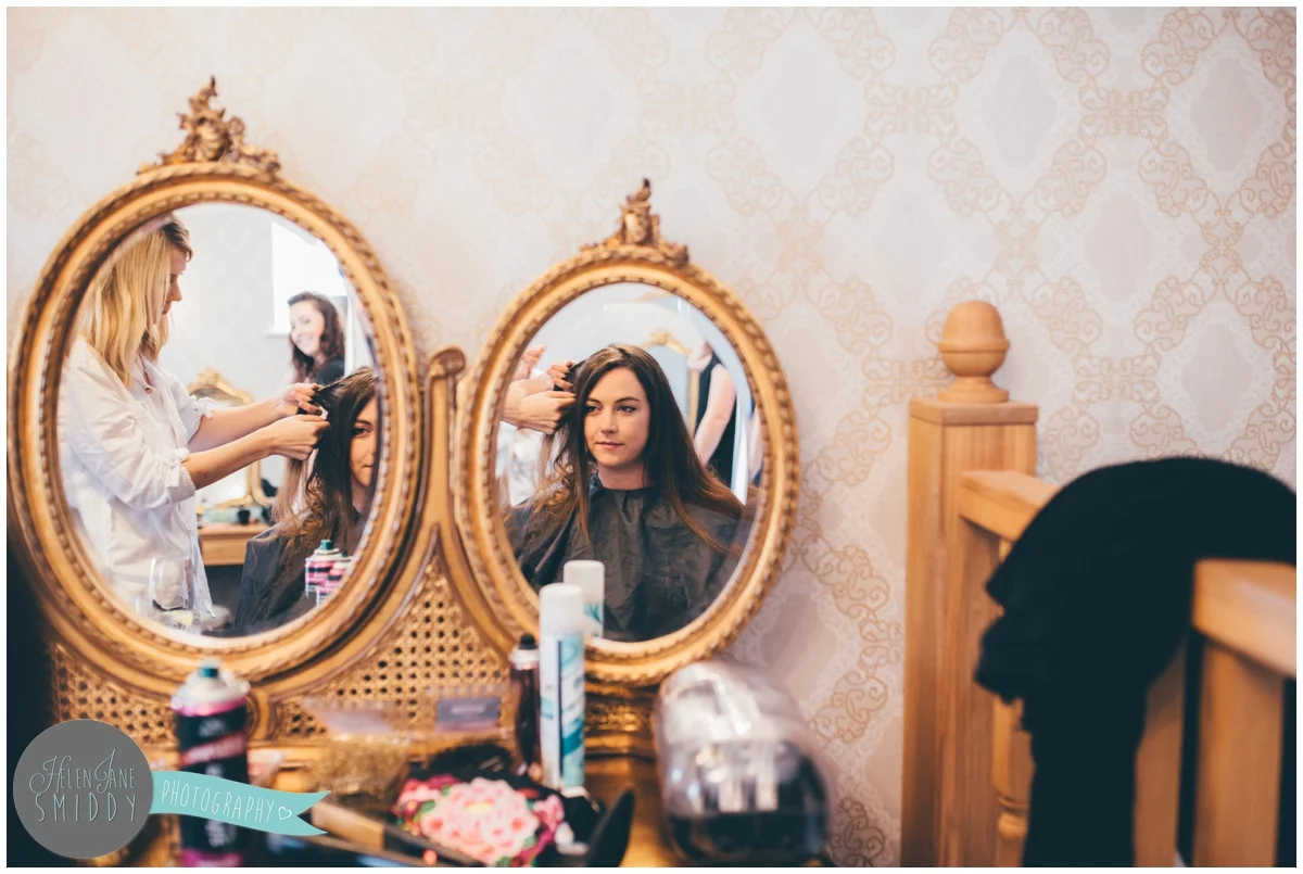 The bridesmaids get ready at Bassmead Manor Barns.