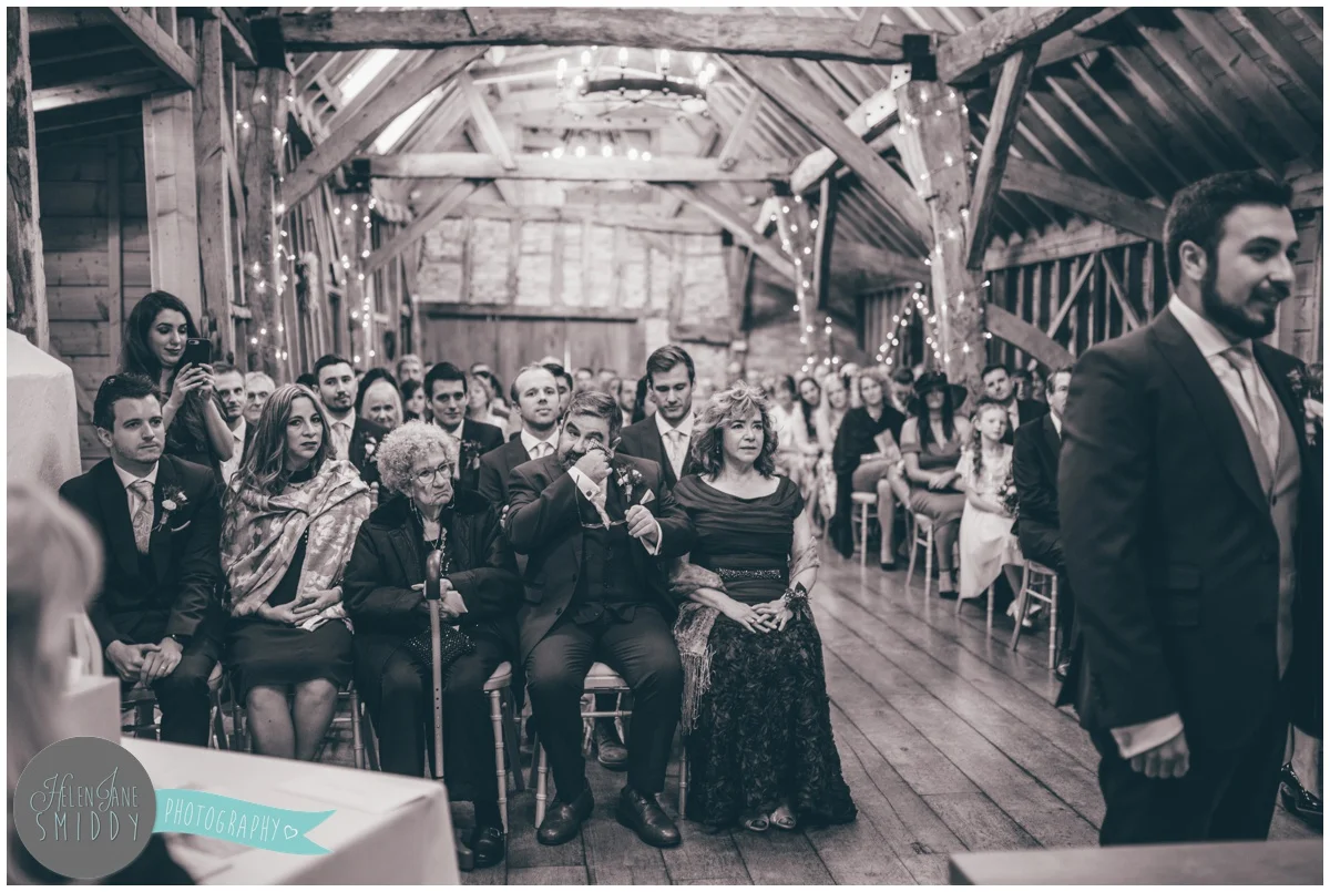 The grooms Mexican family look on happily during the ceremony.