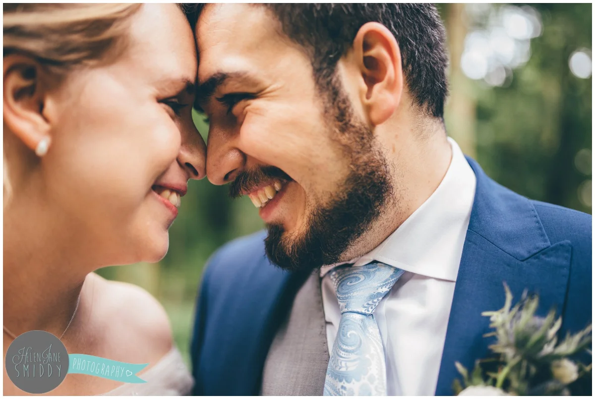 Close-up photograph of the happy couple on their wedding day.