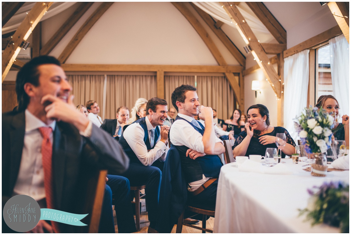 Guests enjoy the Wedding speeches at Bassmead Manor wedding barns.