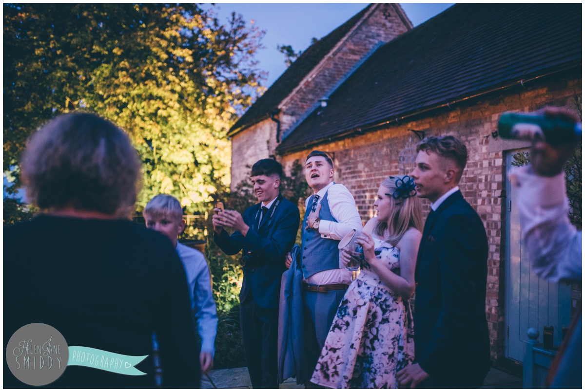 Wedding guests dance and sing along with the Mariachi band at Bassmead Manor barns wedding.