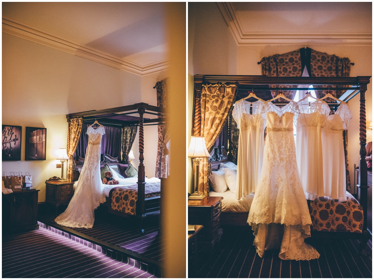 The bride's beautiful wedding gown and bridesmaid dresses hung up at Peckforton Castle.